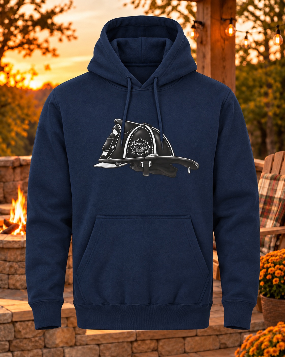 A navy blue pullover hoodie with a black and white firefighter helmet graphic on the chest, displayed against an outdoor patio backdrop at sunset.